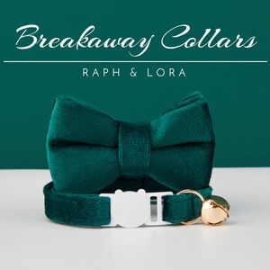 May include: A teal breakaway cat collar with a matching bow tie. The collar has a white safety buckle and a gold bell. The text "Breakaway Collars" and "Raph & Lora" are displayed in white script.