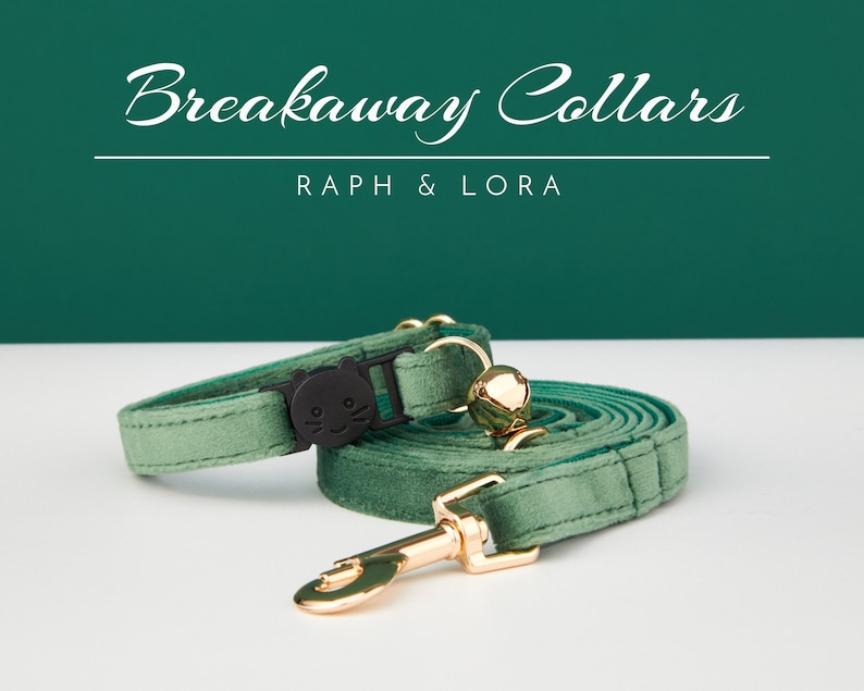 May include: A green velvet breakaway cat collar with a black cat face charm and a gold bell. The collar is attached to a matching green velvet leash with a gold clasp.