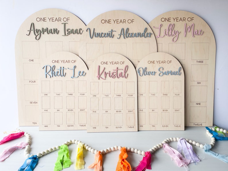 Custom one year photo wooden board.  Personalized birthday photo board made of maple wood.  Featuring 3D name in a variety of colors.  Display photo board at birthday party and use as a room decor after.