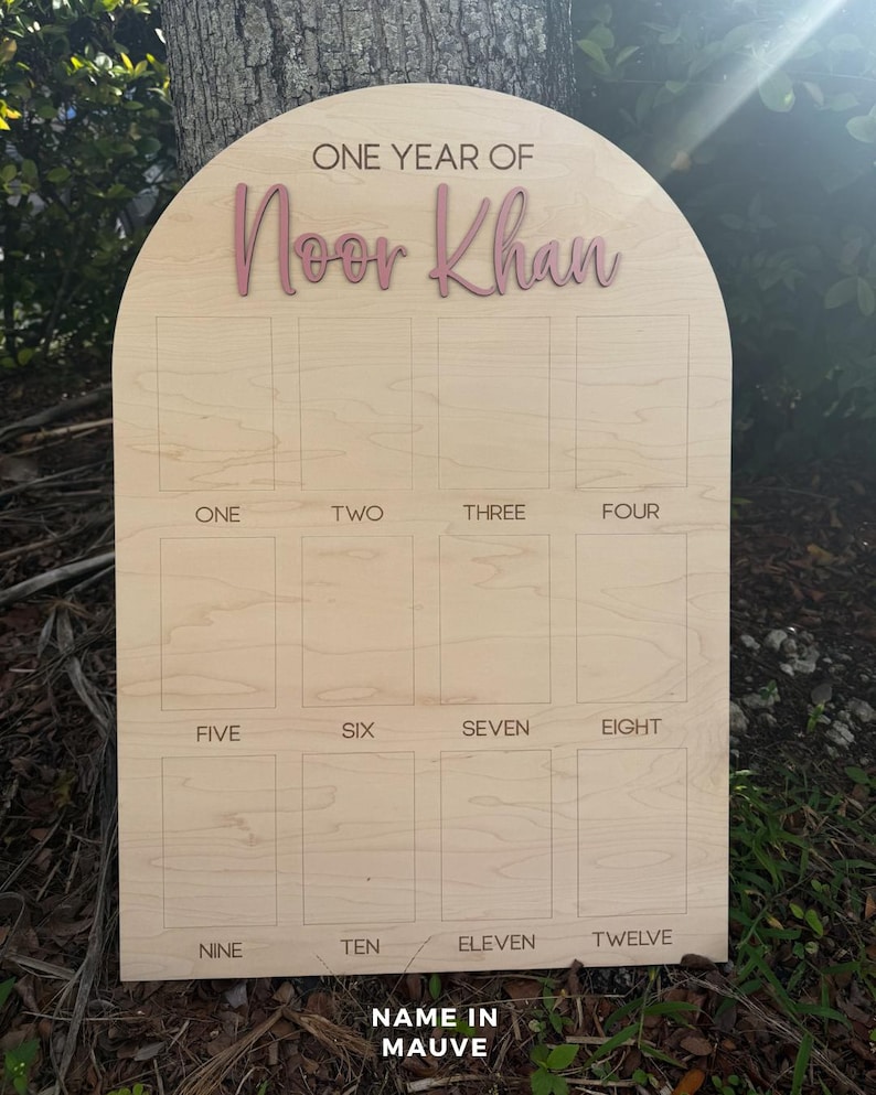 One Year Of photo board.  This birthdayphoto board is our large size.  Our Arch photo boards are peersonalized with a 3D name in a color of your choice.
