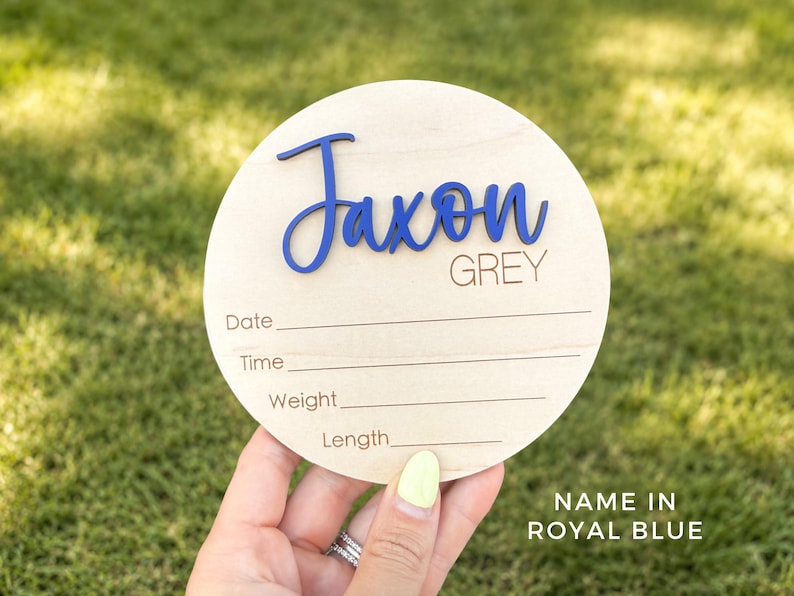 Personalized baby name announcement sign with custom name and birth details.