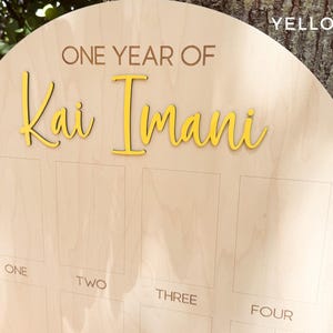 Personalized Birthday picture board with the 3D name in yellow.