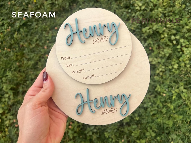Wooden newborn birth announcement plaque with personalized baby name and birth stats.  Also showing 7" baby footprint wooden round.  Both baby announcement rounds are personalized with baby name.