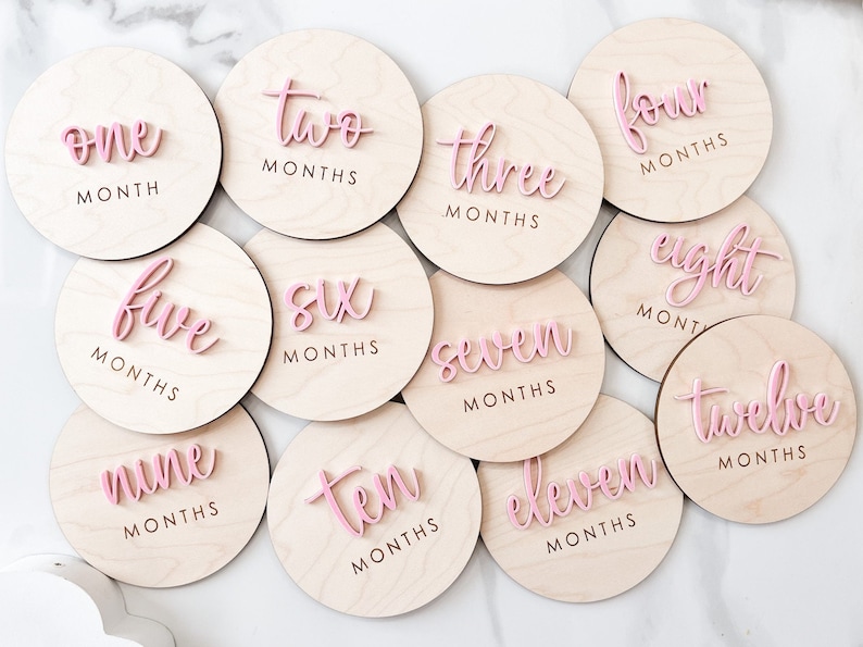 Monthly baby milestones wood rounds.  Perfect props to document baby growth