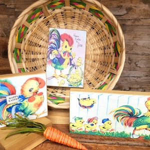 May include: Four wooden blocks with vintage illustrations of chicks and roosters. The blocks feature colorful images and the text "Happy Easter to You".