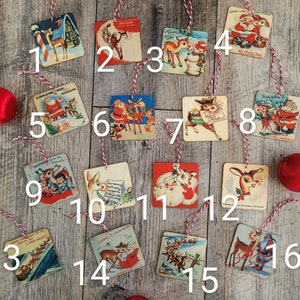 May include: A set of 16 Christmas-themed ornaments, each featuring a different illustration of reindeer, Santa Claus, and other holiday imagery. The ornaments are made of cardboard and have a vintage aesthetic.