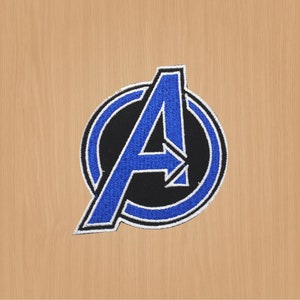 May include: Blue and black embroidered iron-on patch featuring the Avengers logo, a stylised "A" inside a circle.