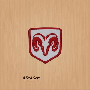 May include: Red embroidered patch with a white ram's head logo on a white background. The patch is shaped like a shield and measures 4.5x4.5 inches.