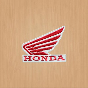 May include: A white embroidered patch with a red stylized wing design and the word "HONDA" in white lettering.