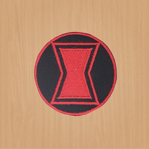 May include: Circular embroidered patch with the Black Widow emblem. The patch has a black background with a red hourglass shape at the centre. The design is outlined in red, creating a striking and easily identifiable symbol.