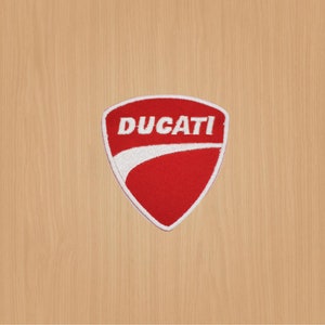 May include: Red and white embroidered patch with the word "DUCATI" in white lettering.