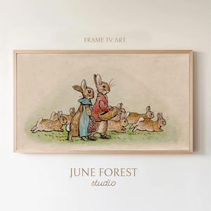 May include: A vintage illustration of Peter Rabbit and his sister, Cottontail, walking with a basket of carrots, followed by a group of other rabbits. The illustration is in a muted color palette with brown, green, and red tones. The image is framed with a light wood frame.