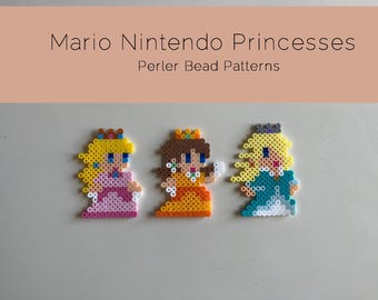 May include: Three pixel art bead sprites of Princess Peach, Princess Daisy, and Rosalina from the Super Mario franchise. The sprites are made with perler beads and are yellow, pink, and blue.