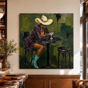 May include: An oil painting on canvas depicting a person wearing a wide-brimmed cream hat, a dark purple blazer, and bright turquoise boots, sitting at a round black table with a martini glass against a textured dark green background.