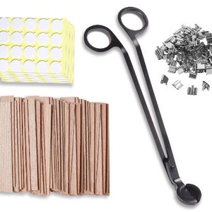 May include: A set of candle making supplies including a pair of black metal candle wick trimmers, a pack of wooden candle wicks, a pack of round adhesive candle stickers, and a pile of silver metal candle flakes.