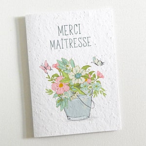 Carte à planter Merci Maîtresse. Faite de papier ensemencé, cette carte se transforme en jolies fleurs. Cadeau fin d’année scolaire