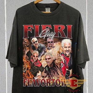 May include: Black t-shirt with a graphic print of Guy Fieri and the text "Fieri Guy Flavortown".