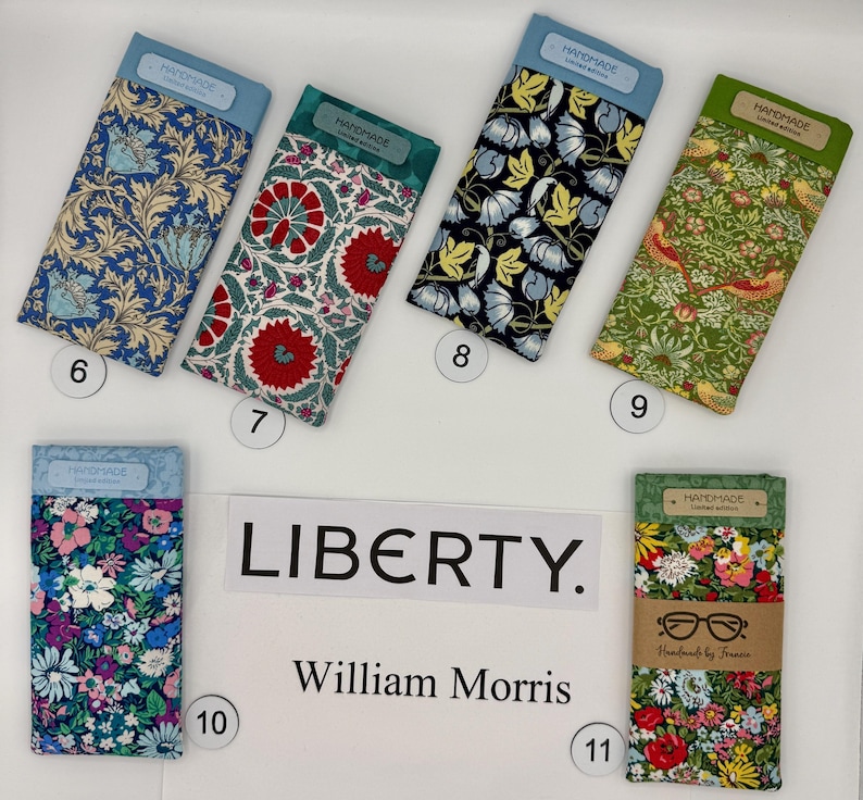 May include: A collection of fabric eyeglass cases with floral and botanical patterns. The cases are labeled with the text "HANDMADE" and "LIBERTY. William Morris". The cases are in various colors, including blue, red, green, and floral prints.