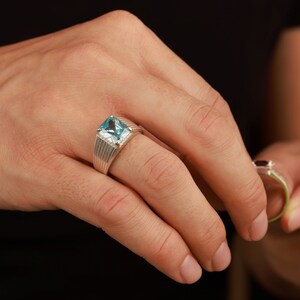 Rectangle cut blue topaz ring in sterling silver - still life