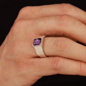 Radiant cut amethyst ring with engraved motifs - male model