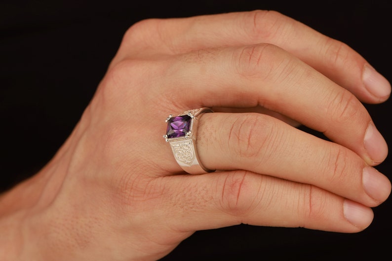 Radiant cut amethyst ring with engraved motifs - male model