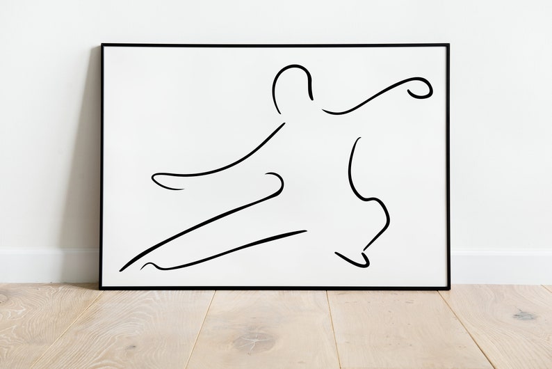 May include: Black and white line art print of a person in a dynamic pose, framed in a black frame.