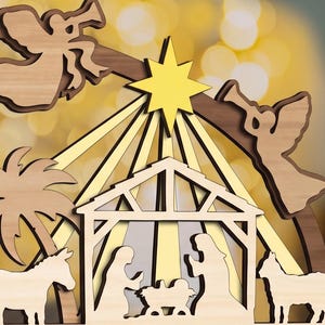 May include: A layered wooden nativity scene featuring a central stable with figures of Mary, Joseph, and the infant Jesus. Two angels with trumpets flank a bright yellow star at the top, with a palm tree and animals on the sides.
