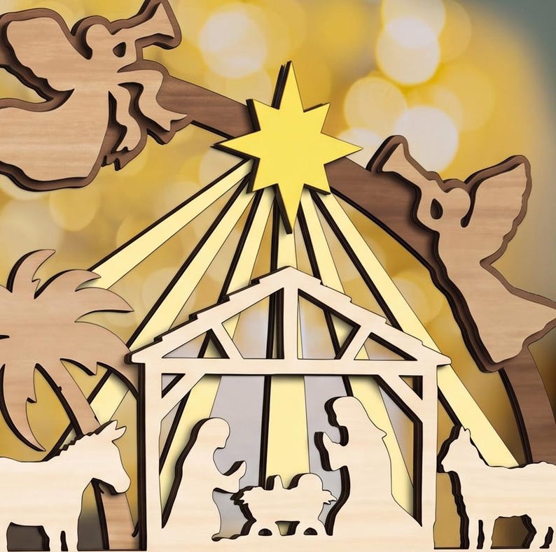 May include: A layered wooden nativity scene featuring a central stable with figures of Mary, Joseph, and the infant Jesus. Two angels with trumpets flank a bright yellow star at the top, with a palm tree and animals on the sides.