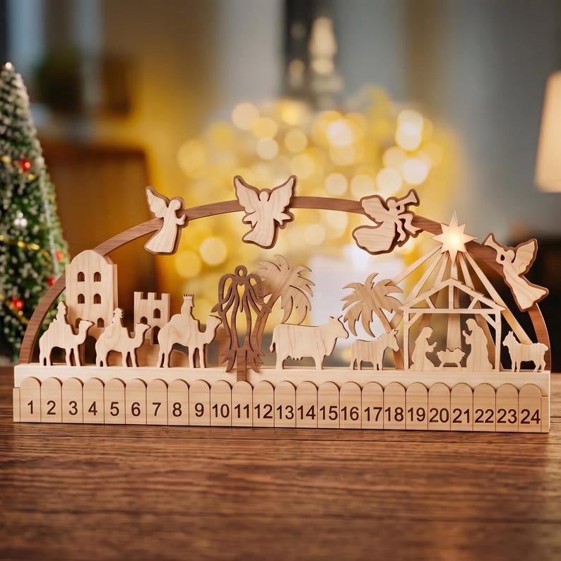 May include: A wooden Christmas advent calendar featuring a nativity scene with carved figures of camels, palm trees, animals, and a stable with a star. The base includes a fence design with numbers 1 through 24 printed in black.