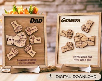 Może przedstawiać: Dwie drewniane tabliczki w ramkach z laserowo grawerowanymi pięściami. Jedna ma napis DAD z imionami Jimmy, Ashley, Bob, Matt, Jane i Betty. Druga ma napis GRANDPA z imionami Betty, Tommy, Matt i John. Obie zawierają tekst TO THE WORLD YOU ARE ONE PERSON, BUT TO US YOU ARE THE WORLD!