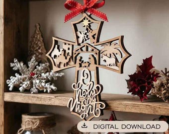May include: A laser-cut wooden cross ornament featuring a nativity scene with camels, a manger, and a palm tree. The text O holy night is carved at the bottom. A red ribbon bow is tied at the top. The image includes the text DIGITAL DOWNLOAD.