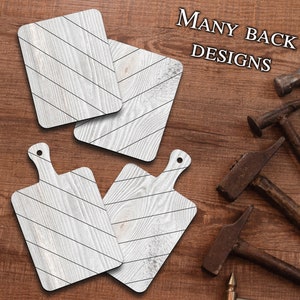 May include: Four wooden cutting boards with a whitewash finish and a diagonal black stripe pattern. The boards have a rustic look and are perfect for serving food or as decorative accents. The text "MANY BACK DESIGNS" is visible in the upper right corner of the image.