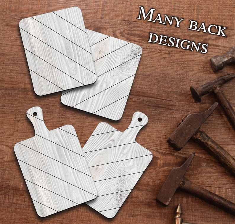 May include: Four wooden cutting boards with a whitewash finish and a diagonal black stripe pattern. The boards have a rustic look and are perfect for serving food or as decorative accents. The text "MANY BACK DESIGNS" is visible in the upper right corner of the image.