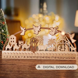May include: A wooden nativity advent calendar featuring a curved arch with carved angels, palm trees, camels, and a stable scene. The base includes a numbered fence from 1 to 24. The text DIGITAL DOWNLOAD is printed in a white rounded rectangle.