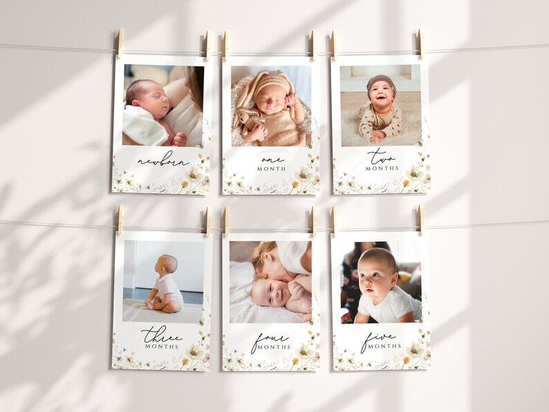 May include: A set of six white photo cards with floral designs and black text. Each card features a baby at different ages, from newborn to five months. The text on the cards reads "newborn", "one month", "two months", "three months", "four months", and "five months".