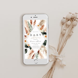 May include: A digital phone screen displaying a baby shower invitation with a floral design. The invitation reads "Join us for a Baby Shower Honoring [name] January 28, 2023 at 2:00 pm".