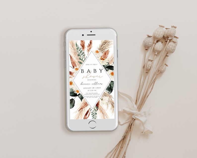 May include: A digital phone screen displaying a baby shower invitation with a floral design. The invitation reads "Join us for a Baby Shower Honoring [name] January 28, 2023 at 2:00 pm".