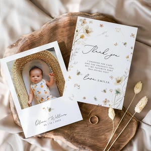 May include: A thank you card with a floral design and the text "Thank you I enjoyed the cake and the presents too but my favorite part was seeing you! Love, Emilia". A photo of a baby in a basket is included on a separate card with the text "Olou Williams 04.11.22.2022".