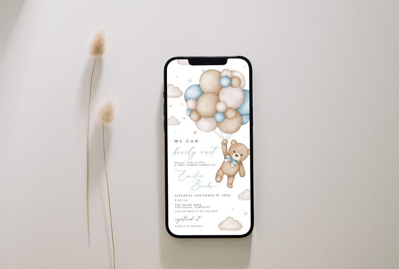 May include: A digital invitation for a baby shower featuring a teddy bear holding onto blue and beige balloons. The text on the invitation reads "We can barely wait!" and "Emily Brooks".