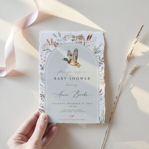May include: A baby shower invitation with a watercolor illustration of a duck in a floral arch. The invitation reads "Please join us for a Baby Shower honoring Anna Brooks, Saturday, November 18, 2022, 1:00 PM, The Sound Farm, Lexington, Kentucky, RSVP by 10/24/2022"
