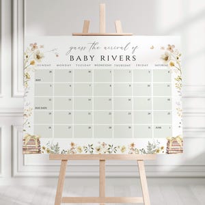 May include: A printable baby shower game with a floral design. The game is called "Guess the Arrival of Baby Rivers" and features a calendar with dates in May and June.