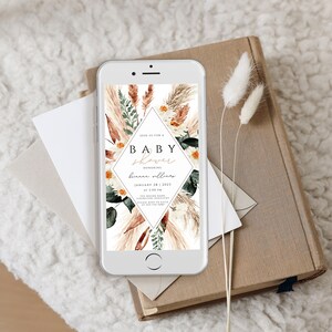 May include: A digital invitation for a baby shower with a floral design. The invitation features a diamond shape with the text "Join us for a Baby Shower Honoring [name] January 28, 2023 at 2:00 PM [address] Please RSVP to [email] by [date]"