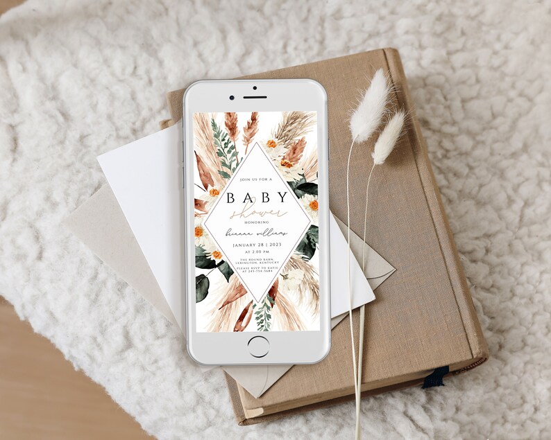 May include: A digital invitation for a baby shower with a floral design. The invitation features a diamond shape with the text "Join us for a Baby Shower Honoring [name] January 28, 2023 at 2:00 PM [address] Please RSVP to [email] by [date]"
