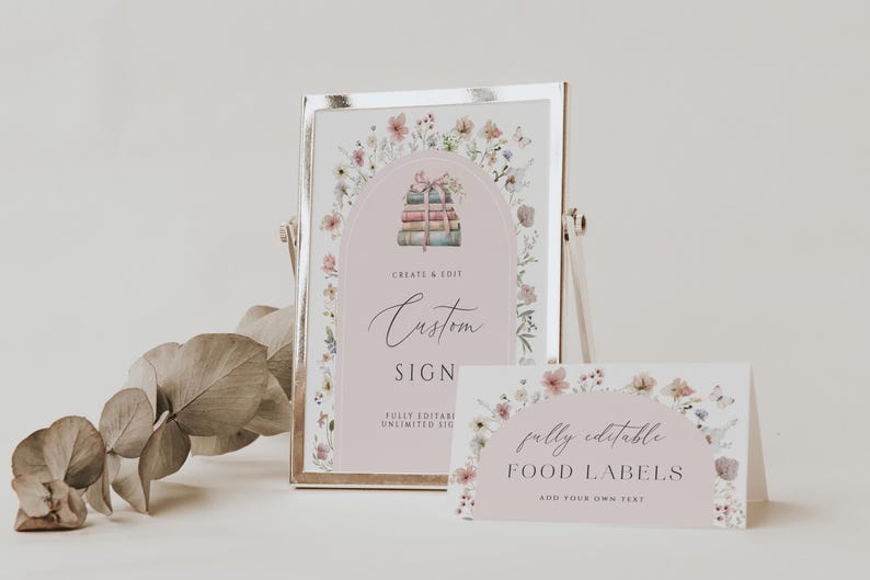 May include: A printable sign with a floral border and a stack of books with a pink ribbon. The sign says "Create & Edit Custom Sign Fully Editable Unlimited Use". A smaller sign with a floral border says "Fully Editable Food Labels Add Your Own Text".