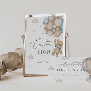 May include: A printable sign featuring a teddy bear holding balloons in blue and brown. The sign reads "Custom Sign" and "Fully Editable Unlimited Size". A smaller sign reads "Fully Editable Food Labels Add Your Own Text".