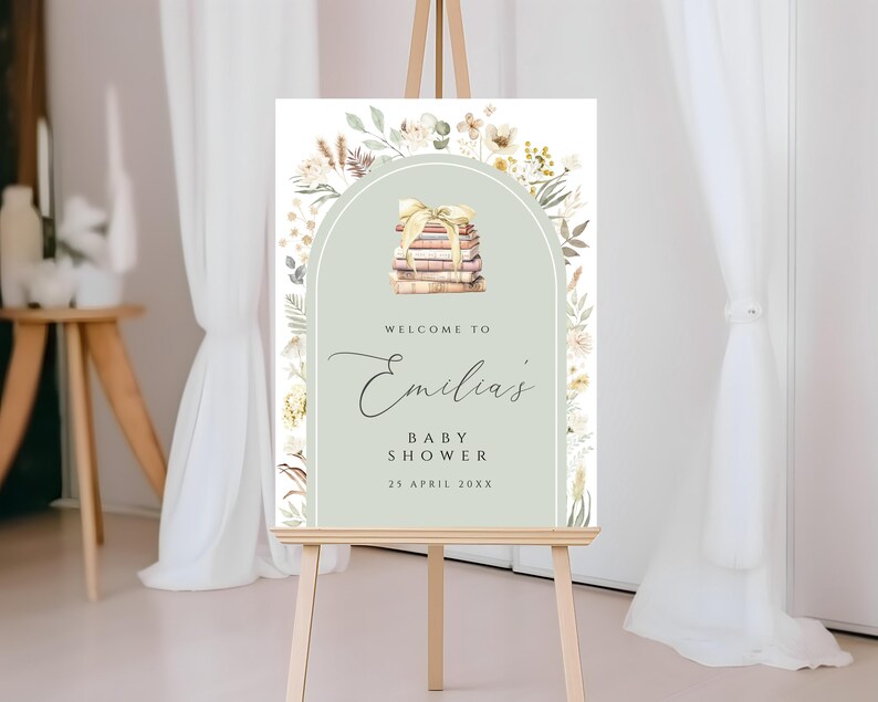 May include: A welcome sign for a baby shower with a green background and floral accents. The sign says "Welcome to Emilia's Baby Shower 25 April 20XX" and features a stack of books with a ribbon.