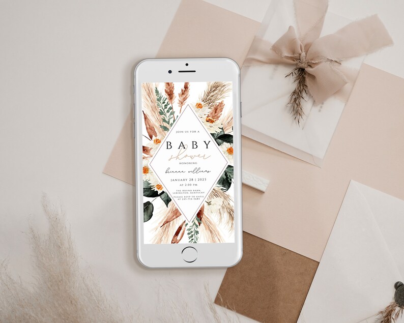 May include: A digital invitation for a baby shower with a boho theme. The invitation features a diamond-shaped design with the text "Join us for a Baby Shower Honoring [name] January 28, 2023 at 2:00 PM [address] RSVP by [date] [phone number] [email address]"