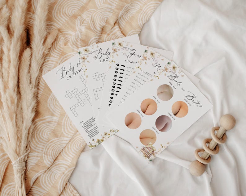 May include: Four printable baby shower game cards with floral designs. The games include a baby shower crossword puzzle, a guess the baby food game, a guess the mommy game, and a guess the baby's bottom game.