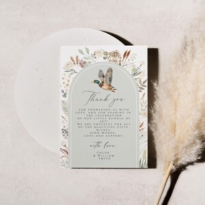 May include: A thank you card with a watercolor illustration of a duck and floral border. The text reads "Thank you for showering us with love and for sharing in the celebration of our little bundle of joy! We are grateful for all of the beautiful gifts, kind words, love and support. With love, Chloe & William Smith."