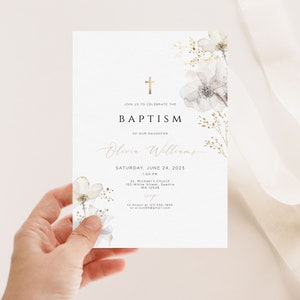May include: A white baptism invitation with a gold cross and floral design. The text reads "Join us to celebrate the Baptism of our daughter Olivia Williams, Saturday, June 24, 2023, 1:00 PM, St. Michael's Church, 123 White Street, Seattle, WA 12548, RSVP to Alison at 123-456-7890 or alison@email.com".